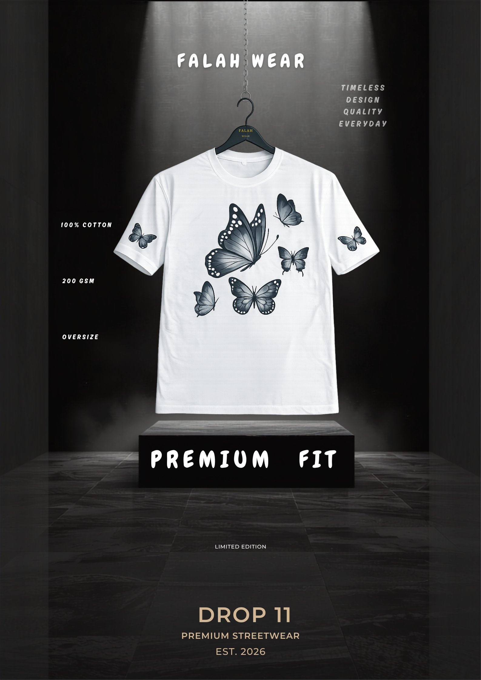 A white short-sleeve t-shirt with a black butterfly graphic print on the front, hanging on a black hanger against a dark, dramatic studio backdrop. The brand name 'FALAH WEAR' is displayed at the top, and the t-shirt is presented on a black pedestal labeled 'PREMIUM FIT'.